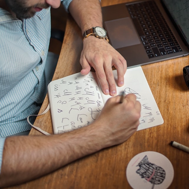 Founder sketching their brand logo