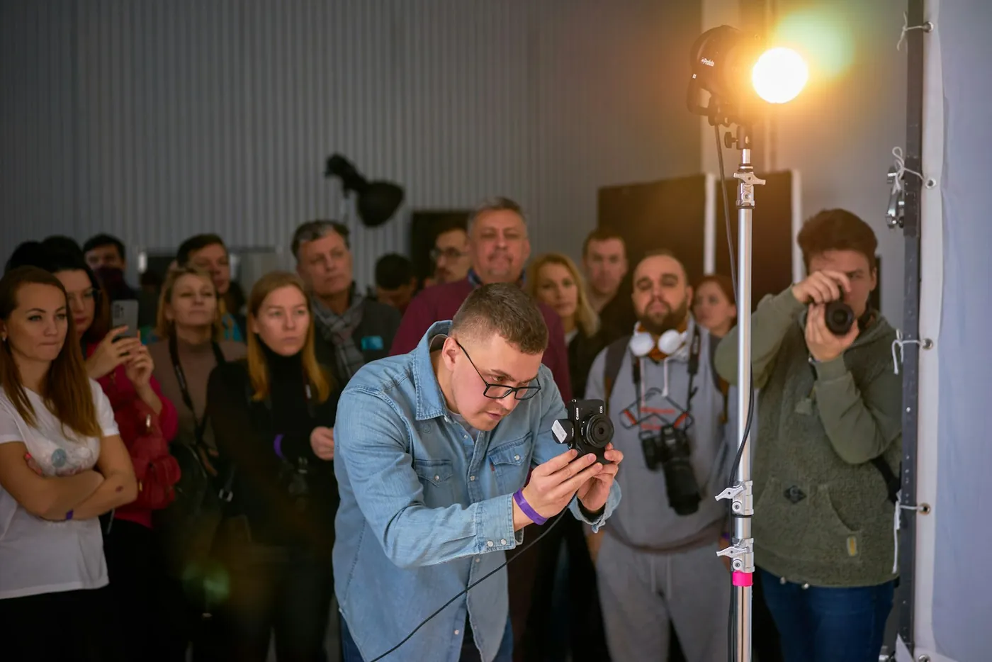 Someone filming in front of an audience